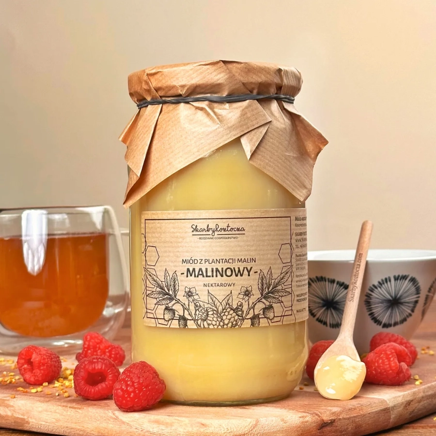 miod-malinowy-1000g-skarby-roztocza-skrystalizowany-front-produktowe-herbata-lyzeczka-kwadrat.webp