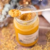 miel au pollen d'abeille moulu grand pot trésors de roztocze cuillère texture
